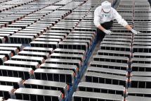 This photo taken on 12 March 2021 shows a worker with car batteries at a factory for Xinwangda Electric Vehicle Battery Co. Ltd, which makes lithium batteries for electric cars and other uses, in Nanjing in China's eastern Jiangsu province. Photo: AFP