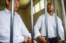 Australians Mr Andrew Chan (L) and Mr Myuran Sukumaran (R) inside a holding cell waiting for trial at a Denpasar District Court in Bali, Indonesia. Mr Chan, 31, and Mr Sukumaran, 34, are the only members of the so-called Bali Nine drug smuggling ring on death row for trying to smuggle 8.3 kilogrammes of heroin from the Indonesian resort island of Bali to Australia in 2005. Photo: Made Nagi/EPA
