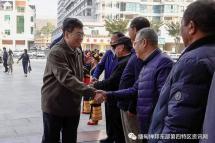 Deng Xijun is welcomed by EAO representatives in Mong La on February 20.