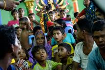 Displaced Hindu people who fled from Maungdaw township gather inside a temple in Siittwe of Rakhine State, western Myanmar, 05 September 2017. Photo: Nyunt Win/EPA
