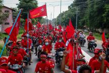 Supporters of the National League for Democracy (NLD) party ride a motorcade during a campaign in Wundwin, near Mandalay on September 19, 2020. Photo: Kyaw Thet Zin/AFP