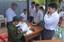 Military personnel and their family members waited at the entrance of an army hospital in Yangon’s Mingalardon township to vote in the general elections last month. (Photo: Myanmar Now)
