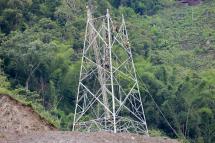 (File) Myanmar workers with cables being attached to a newly built electric pylon on the hill at Kengtung district in Shan State, Myanmar, 24 June 2019. Photo: Lynn Bo Bo/EPA
