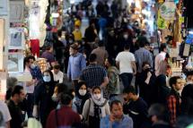 Iranians wearing face masks and protective gloves go shopping at Tehran's grand bazaar in Tehran, Iran. Photo: EPA