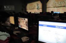 (File) Chinese netizens use computers at an internet cafe in Wuhan, central China's Hubei province. Photo: AFP