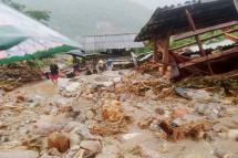 A handout photo made available by Vietnam News Agency shows a general view of the damage caused by a landslide triggered by torrential rains in Lai Chau, northern Vietnam, 06 August 2023. Photo: EPA
