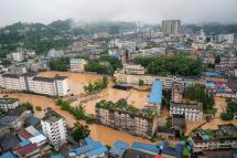 (File) An aerial view shows a flooded part of Enshi City, Hubei province, China, 17 July 2020. Photo: EPA
