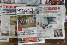 Newspapers on a news stand in Yangon. Photo: AFP