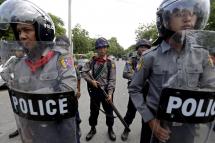 Hate speech and social media posts led to conflict - Riot police block a road in Mandalay, Myanmar, 04 July 2014. One Buddhist and one Muslim were killed and 14 people injured in two nights of clashes. The violence followed allegations that two Muslim brothers who own a teashop raped a Buddhist female member of staff. Photo: EPA