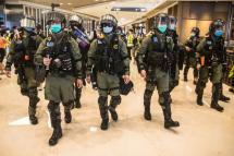 Riot police secure a shopping mall after prostesters gathered to mark one year since a group of white-clad men attacked pro-democracy protesters who were returning home from protests at the nearby Yuen Long train station, in Hong Kong on July 21, 2020. Dale De Larey/AFP
