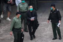 Hong Kong pro-democracy activist Benny Tai (C) walks towards a Hong Kong Correctional Services van at the Lai Chi Kok Reception Centre where he was taken after appearing at the West Kowloon Court the day before on the charge of conspiracy to commit subversion, in Hong Kong early on March 2, 2021. Photo: AFP