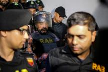 Rapid Action Battalion (RAB) escort ruling party leader Ismail Hossain Samrat following his arrest in Dhaka on October 6, 2019. Photo: AFP