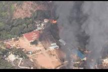 Houses burned by SAC troops in Nam Neang village.