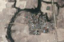 This handout satellite image from Planet Labs taken on May 16, 2020 and released by Human Rights Watch on May 26, 2020 shows Let Kar village in Myanmar's Rakhine State before 200 buildings in the village are believed to have been destroyed by fire (AFP Photo/Handout) 