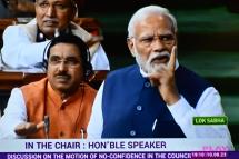 In this screen grab India's Prime Minister Narendra Modi (R) is seen on a television screen as he addresses the lower house Lok Sabha in New Delhi on August 10, 2023, in response to the Opposition's no-confidence motion against the NDA government. Photo: AFP