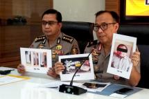  Indonesian police personnel show photographs of leader Para Wijayanto and various seized items, at a press conference in Jakarta on July 1, 2019, as Wijayanto was detained by counter-terrorism police with his wife on at a hotel in Bekasi, a city on the outskirts of the capital Jakarta. Photo: AFP