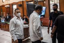 Suko Sutrisno (L), a security official, and Abdul Haris (C), a match organiser, attend their trial at a courthouse in Surabaya on March 9, 2023. Photo: AFP