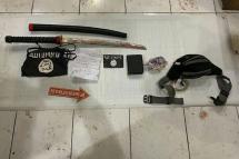 Indonesian police displayed items allegedly linked to the fatal attack by a sword-wielding militant on a policeman (AFP Photo/Handout)