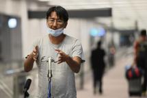 Japanese journalist Yuki Kitazumi, who was arrested by security forces while covering the aftermath of the Myanmar coup, speaks to the media upon his arrival at Narita Airport in Narita, Chiba prefecture on May 14, 2021, after charges against him were dropped as a diplomatic gesture. Photo: Kazuhiro NOGI/AFP