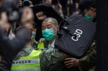 (FILE) - Media mogul Jimmy Lai (C) is escorted out of a Correctional Services Department vehicle and into the Court of Final Appeal in Hong Kong, China, 09 February 2021. Photo: EPA