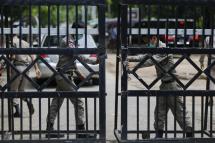 (File) Staff members of Prisons Department close the main entrance of the Insein prison compound in Yangon, Myanmar. Photo: EPA