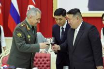 A photo released by the official North Korean Central News Agency (KCNA) shows North Korean Supreme leader Kim Jong-un (C), having a toast with Russian Defense Minister Sergei Shoigu (L) during a reception for the minister and his military delegation in Pyongyang, North Korea, 27 July 2023. Photo: EPA