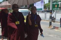 Last September, a group of Buddhist monks walked in front of the office of Union Solidarity and Development Party in the town of Pathein in the Ayeyarwady Delta to join a rally which which was held to celebrate the success of ‘race and religion’ laws. (Photo: Swe Win/Myanmar Now)
