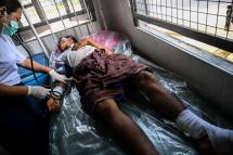 This photo taken on August 25, 2019 shows a man, injured during clashes between the military and ethnic rebel groups, being attended to in the Kutkai hospital in Shan State. Photo: Ye Aung Thu/AFP