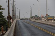 A view of a road blocked by protesters and resident near BayintNaung bridge which link to Hlaingthaya (Hlaing Tharyar) Township, outskirts of Yangon, Myanmar, 14 March 2021. Photo: EPA
