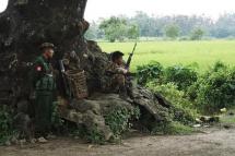 Myanmar soldiers stand guard at a check point in a rural road near Maungdaw. Photo: AFP