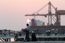 A Myanmar man selling his products at a pier at the Bo Ta Htaung Port in Yangon. Photo: AFP