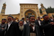 Muslim men of the Uighur ethnic group leaving the Id Kah Mosque after Friday prayers in Kashgar, Xinjiang Uighur Autonomous Region, China. Photo: EPA