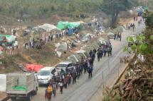 Supporters arrive near temporary camps where members of community based anti-narcotic campaigners gather near a blocked area in Wine Maw, northern Kachin State, Myanmar, 21 February 2016. According to media reports, about 3,000 volunteers of a community based anti-narcotic campaign have been camping on the road since 16 February, blocked by Myanmar military and police forces who try to prevent them from destroying the fields of opium poppies. Photo: Myitkyina News Journal/EPA
