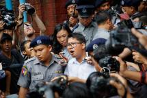 Reuters journalist Wa Lone (C) is escorted out of the Insein township court in Yangon, Myanmar, 03 September 2018. Photo: Lynn Bo Bo/EPA