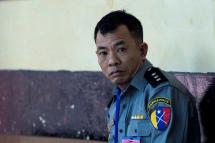 (FILES) In this file photo taken on April 20, 2018, Myanmar deputy police major Moe Yan Naing waits outside the courthouse before attending the ongoing trial of two detained journalists in Yangon. Photo: Sai Aung Main/AFP
