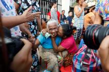 Prisoners reunite with family members outside the Insein Prison in Yangon, Myanmar, 17 April 2019. Photo: Nyein Chan Naing/EPA