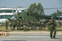 Myanmar government troops board a military helicopter in Muse located in Shan State of Myanmar near China's border in 2016. Photo: Ko Sai/AFP
