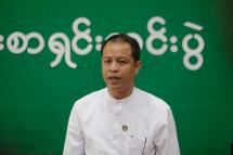 (File) Nanda Hla Myint, a spokes person of the Union Solidarity and Development Party (USDP), talks to journalist during a press conference. Photo: EPA