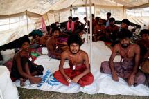 Migrants allowed to land by the Myanmar Navy rest in A UNHCR tent at the Mee Tike temporary camp near MaungDaw township, Rakhine State, western Myanmar, 04 June 2015. Photo: Nyunt Win/EPA
