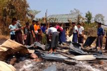 Locals survey the damage after fighting between Myanmar's military and ethnic Rakhine insurgents near the town of Mrauk U, former capital of the Rakhine kingdom. Photo: AFP