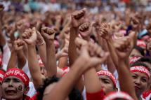 People raise their hands as they gather in front of Yangon City Hall during a rally in support of amending to the 2008 constitution of Myanmar, Yangon, Myanmar, 17 July 2019. Photo: Lynn Bo Bo/EPA