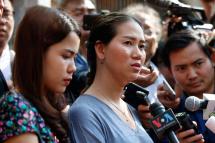 Pan Ei Mon (R) and Chit Su Win (L), wives of jailed Reuters journalists Wa Lone and Kyaw Soe Oo, talk to the media at a court in Yangon, Myanmar, 11 January 2019. Photo: Nyein Chan Naing/EPA