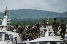 (File) Myanmar soldiers arrive at Buthidaung jetty in Myanmar's Rakhine State on August 29, 2017. Photo: AFP