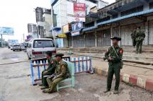 Myanmar soldiers stand guard at a check point in Lashio, Shan State, Myanmar, May 30, 2013. Photo: Nyein Chan Naing/EPA
