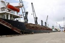 (File) A ship loaded with teak wood logs at the Thilawa port, Yangon, Myanmar. Photo: EPA
