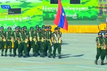 Myanmar troops and weaponry parade through the capital Naypyidaw to mark Independence Day Wednesday, days after the military junta increased democracy figurehead Aung San Suu Kyi's jail term to 33 years. Screenshot from MRTV
