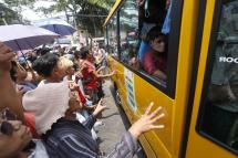 Relatives and friends of prisoners gather around a bus carrying inmates upon their release from Insein prison in Yangon, Myanmar, 17 April 2023. Photo: EPA