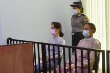 Subject: This handout photo taken on May 24, 2021 and released by Myanmar's Ministry of Information on May 26 shows detained civilian leader Aung San Suu Kyi (L) and detained president Win Myint (R) during their first court appearance in Naypyidaw.