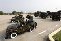 Myanmar soldiers drive military vehicles during a parade commemorating the 77th Armed Forces Day in Naypyidaw Myanmar, 27 March 2022. Photo: EPA