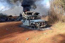 This handout image from the Karenni Nationalities Defense Force (KNDF) taken and released on December 25, 2021 shows burnt vehicles in Hpruso township in Kayah state. Photo: KNDF/AFP